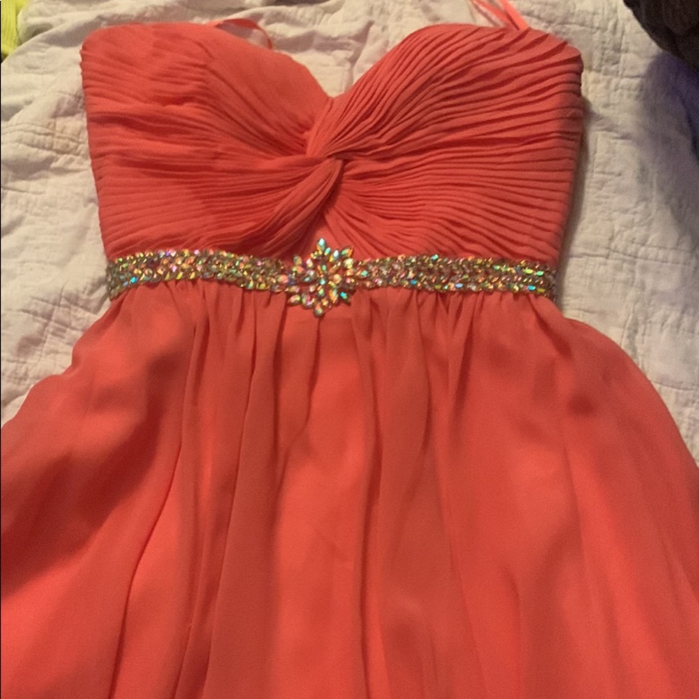 Coral strapless formal dress, it’s been worn once about 4 years ago.